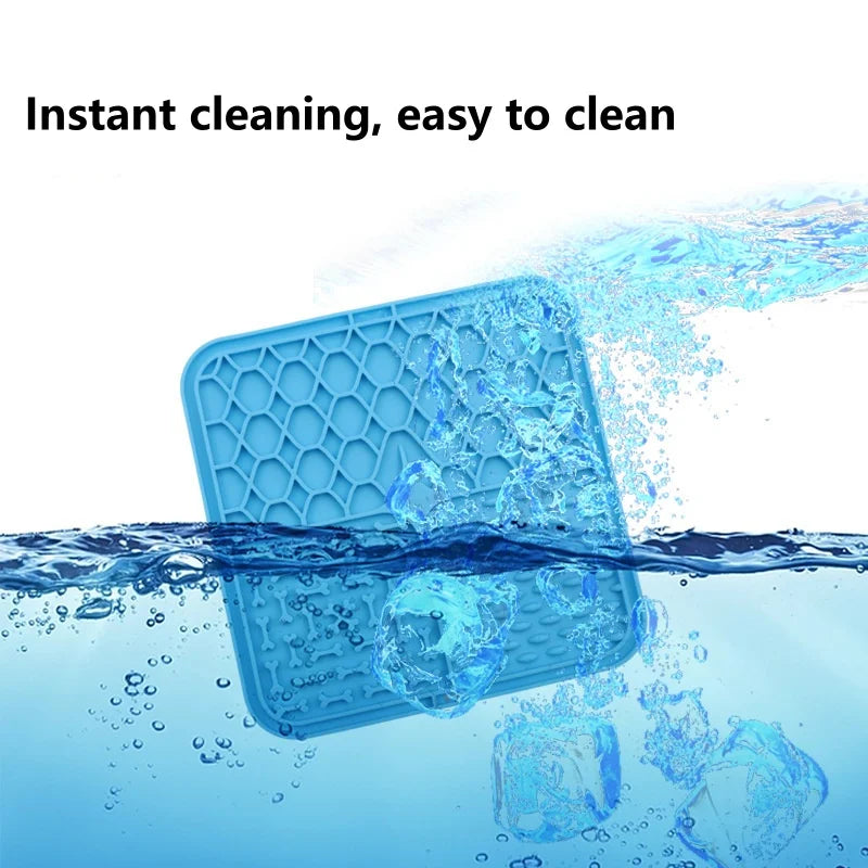 Blue lick mat splashing into water with ice cubes