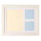 The white frame with its mat, empty