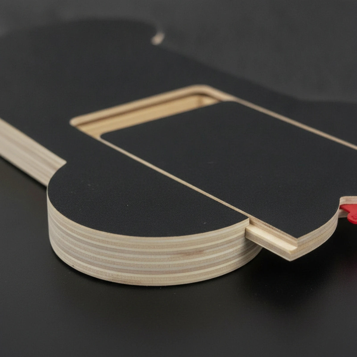 Close-up of the layered plywood edge and the drawer