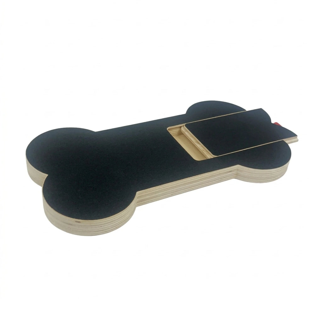 The bone board with its sandpaper-top treat drawer slid half open