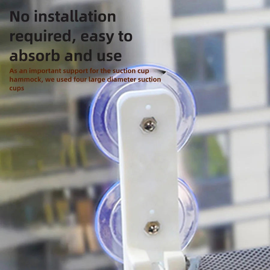 Close-up of a bracket holding two clear suction cups on the glass