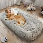 Woman asleep in the gray shag bed hugging a golden retriever under a shag blanket