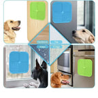 Lick mats stuck to a wood floor, a fridge, window glass and a steel appliance, dogs licking
