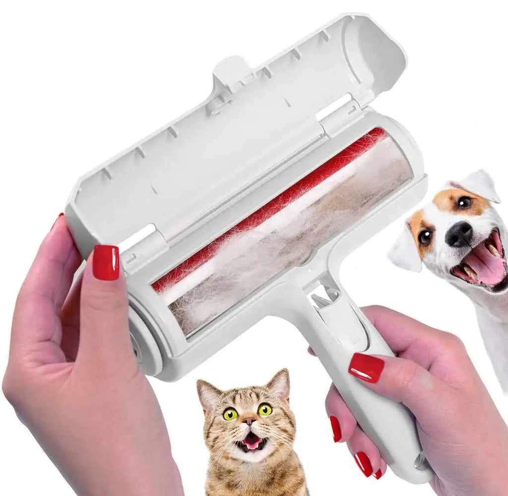 Open roller with its chamber full of fur, a Jack Russell and a tabby cat beside it